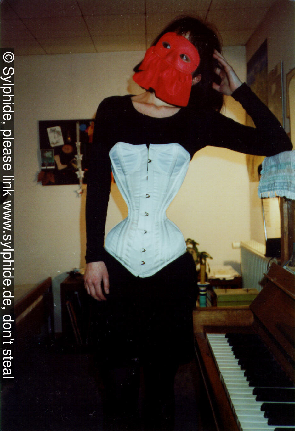 Satin corset 17 inch tightlaced to wasp waist at piano (front) Sylphide figure training tight lacing corset laced wasp waist tightlaced