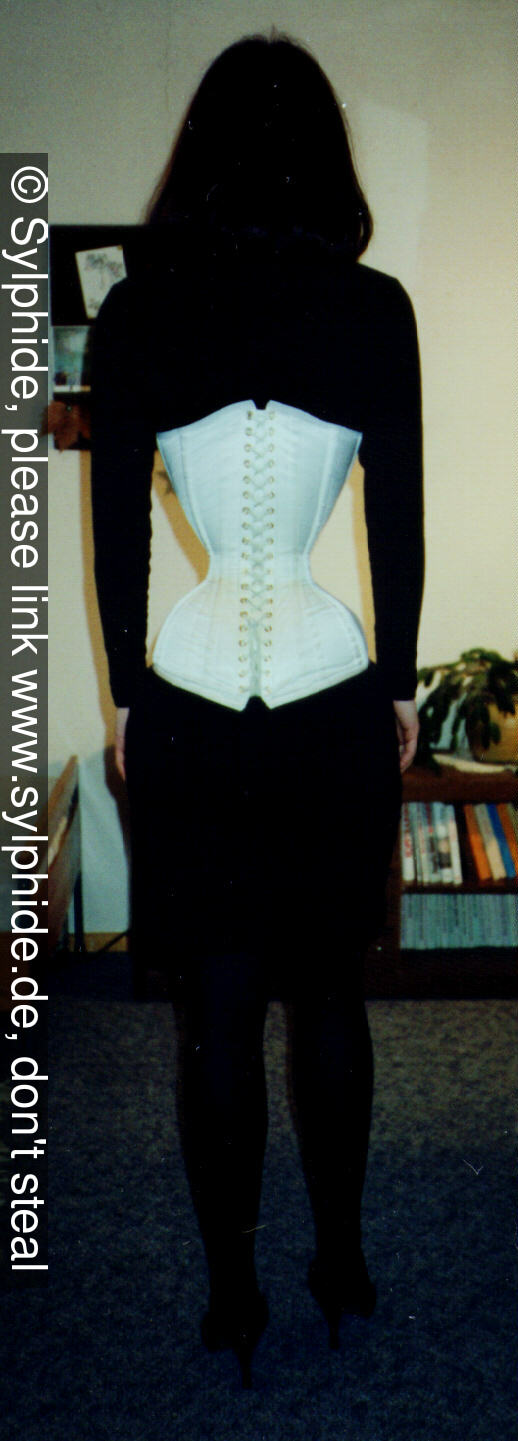 Satin corset 17 inch tightlaced to wasp waist standing (back) Sylphide figure training tight lacing corset laced wasp waist tightlaced