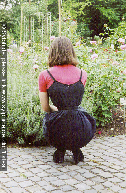 Tight 19 inch satin corset under a belted dress Sylphide figure training tight lacing corset laced wasp waist tightlaced